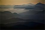 An aerial view of the landscape, islands, water and mountains of the Broughton Archipelago at sunset.