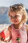 Little girl with a watermelon slice