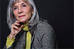 Studio portrait of attractive senior woman