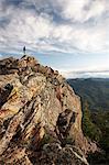 Man standing on rock formation, Boulder, Colorado, USA