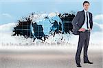 Smiling businessman with hands on hips against splash showing earth graphic