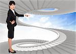 Businesswoman pointing against spiral staircase in the sky