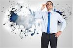 Thinking businessman tilting glasses against splash on wall revealing clouds