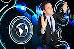 Businessman posing with arms raised against futuristic technology interface