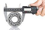 Metal vernier caliper and Ball bearings on white background