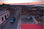 Overview of streets and rooftops of buildings at dusk, Cienfuegos, Cuba, West Indies, Caribbean, Central America