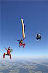 Three persons skydiving, Leutkirch im Allgaeu, Baden-Wuerttemberg, Germany, Europe