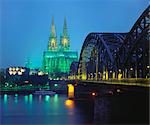 Hohenzollernbrucke and the Cathedral Illuminated at Night, Cologne, Germany