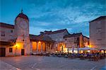 Main square lit up at dusk with cafes, Trogir, UNESCO World Heritage Site, Dalmatian Coast, Croatia, Europe