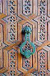 Detail of a wooden door and bronze knocker, Islamo-Andalucian art, Marrakech Museum, Marrakech, Morocco, North Africa, Africa