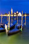 Gondolas moored in St. Mark's Basin in the evening with San Giorgio Maggiore in the distance, Venice, UNESCO World Heritage Site, Veneto, Italy, Europe