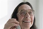 Senior woman wearing glasses on the phone