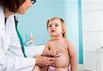 Doctor with Baby Girl in Doctor's Office