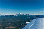 View over wing of a light aircraft of Mount Mc Loughlin, Klamath County, Medford, Oregon, USA