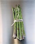 Bunch of asparagus on grey background
