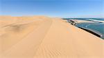 The dunes and lagoon of Sandwich Harbour, just south of Walvis Bay and within the Namib Naukluft Park, Namibia, Africa