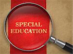 Special Education concept. Magnifying Glass on Old Paper with Red Vertical Line Background.