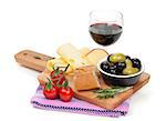 Red wine with cheese, bread, olives and spices. Isolated on white background