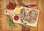 Grilled sausages with ketchup and mustard. Over wooden table background