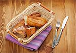 Homemade french bread over wooden table background