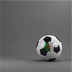 Algerian soccer ball in front of plaster wall