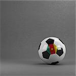 Cameroonian soccer ball in front of plaster wall