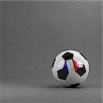 French soccer ball in front of plaster wall