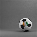 Ivorian soccer ball in front of plaster wall