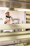 Portrait of a confident male chef standing in the kitchen