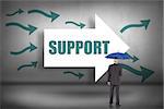 The word support and businessman holding umbrella against arrows pointing