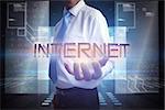 Businessman presenting the word internet against hologram on black background with squares