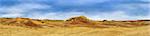 Beautiful landscape of the Judean Desert. Yellow and red hills and blue sky. Panorama.