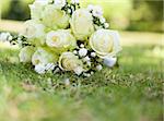 Close-up of bridal bouquet on grass at the park