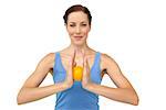 Portrait of a content young woman holding stress ball over white  background