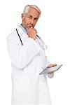 Portrait of a male doctor using digital tablet over white background