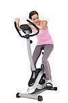 Full length of a beautiful young woman on stationary bike over white background