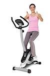 Full length of a beautiful young woman gesturing thumbs up on stationary bike over white background