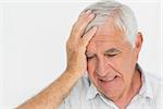 Close-up of a worried senior man over white background