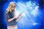 Digital composite of stylish blonde using tablet pc with email and interfaces