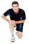 adult attractive man in sportswear knee pain injury ache isolated on white