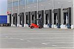 Forklift and loading ramps at distribution warehouse