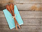 Vintage kitchen utensils over wooden table with copy space