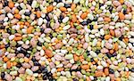 Mixed dried beans - black turtle beans, flageolet beans, pinto beans, brown beans, haricot beans, green split peas and yellow split peas - abstract background texture