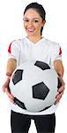 Pretty football fan in white smiling on white background