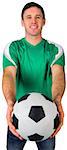 Handsome football fan in green on white background