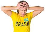 Disappointed football fan in brasil tshirt on white background