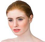 Beautiful redhead posing with hair tied on white background