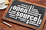 computer software development concept - open source word cloud  on a vintage blackboard