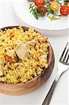 rice with chicken and vegetable saladclose up