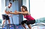 Couple working out in gym